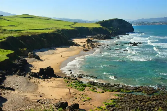 Aerial view of the rugged and beautiful Asturian coastline, perfect for exploring during summer camp.