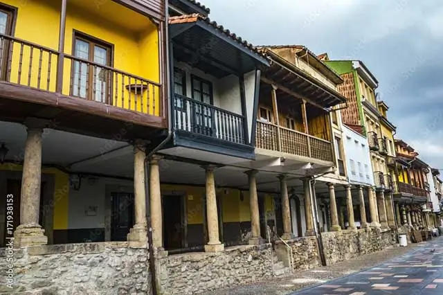 Cobblestone Galiana Street with traditional architecture in Avilés, Asturias.