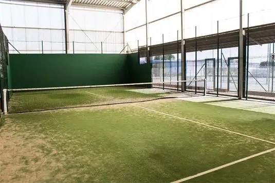 Covered padel court at the summer camp sports campus in Northern Spain.