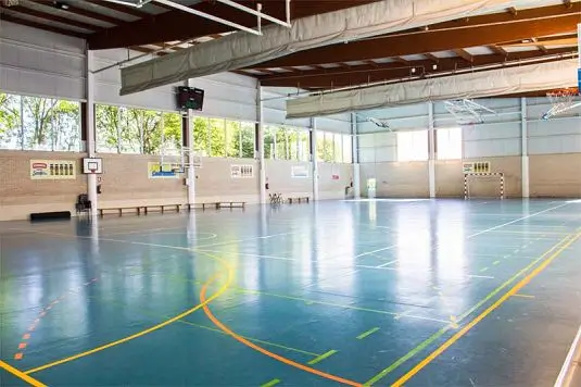 Indoor sports hall at the summer camp, equipped for various activities in Northern Spain.